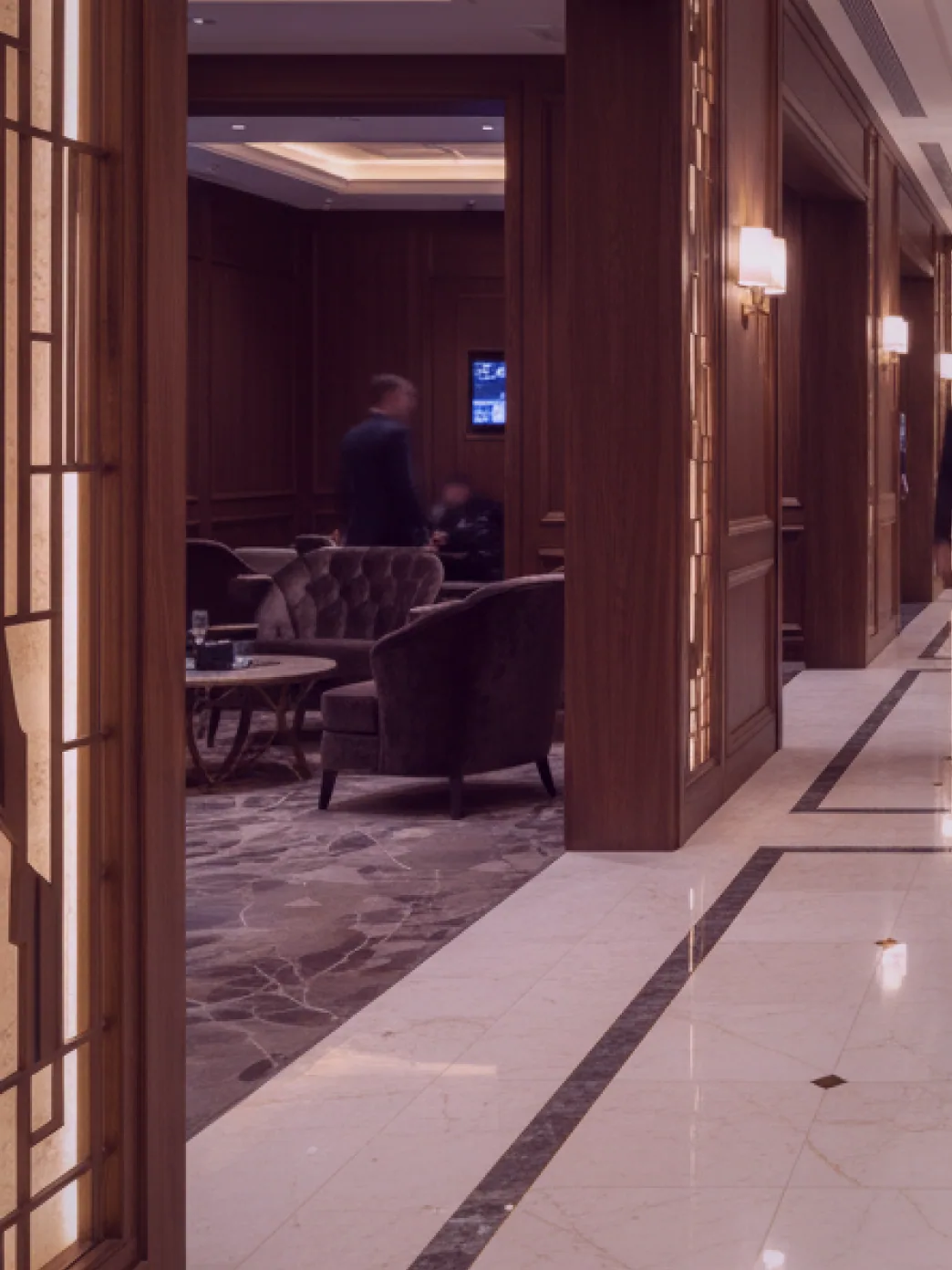 A second angle of the card room, showing the fireplace and two of the tables